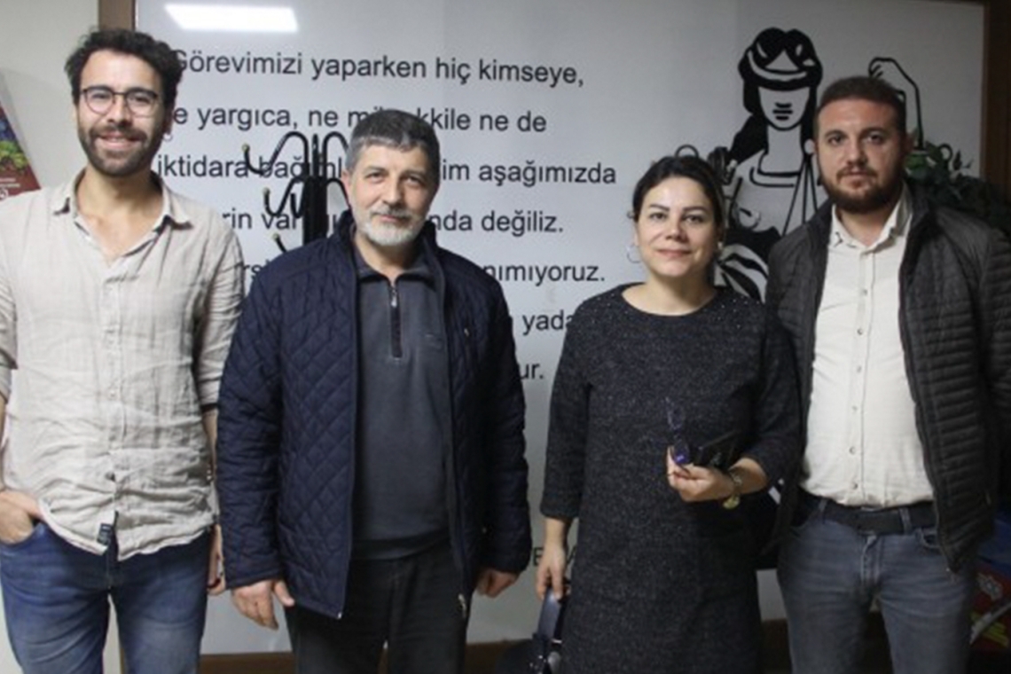 İrfan Uçar (second left) pictured with MLSA lawyer Fatih Aydın (first left) after his release from detention.