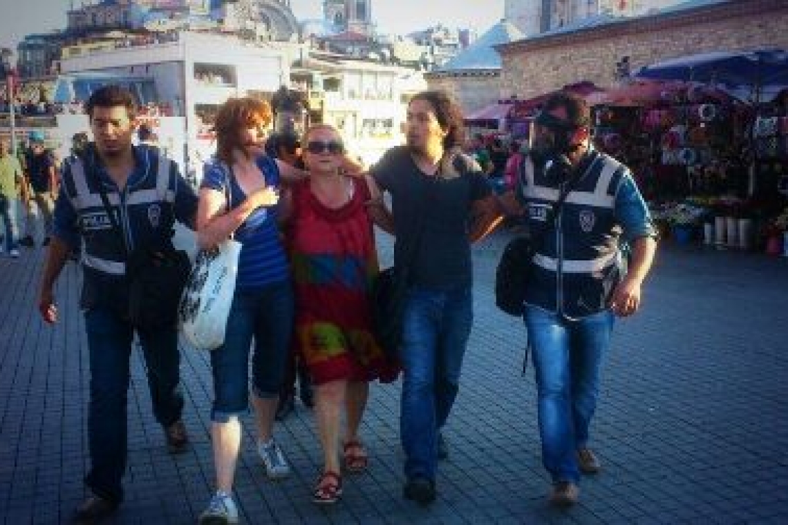 Mücella Yapıcı (in the middle) being detained during Gezi proests in 2013